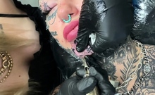 Australian bombshell Amber Luke gets a new chin tattoo